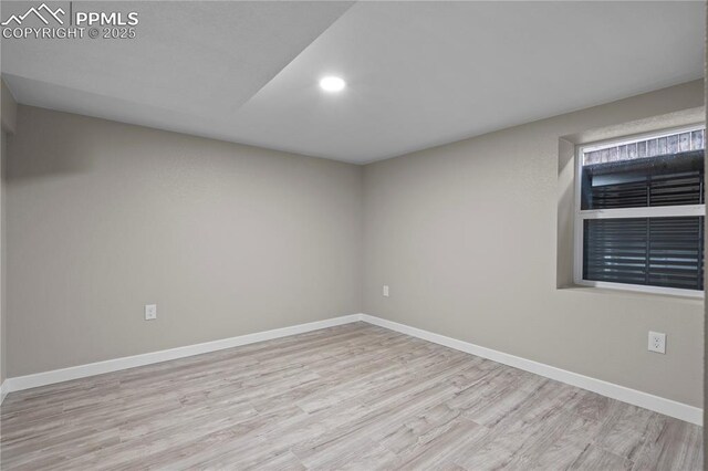 1205 Catalpa St, Pueblo, CO 81001 - spare room featuring wood finished floors, baseboards, and recessed lighting