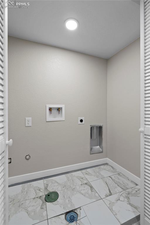 1205 Catalpa St, Pueblo, CO 81001 - laundry room featuring marble finish floors, washer hookup, baseboards, hookup for an electric dryer, and hookup for a gas dryer