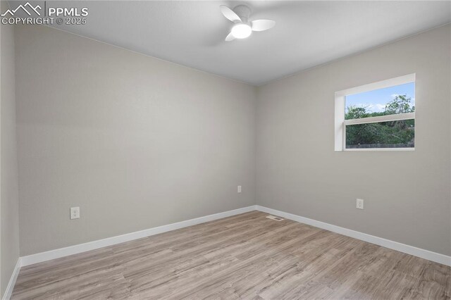 1205 Catalpa St, Pueblo, CO 81001 - spare room featuring wood finished floors, baseboards, and a ceiling fan