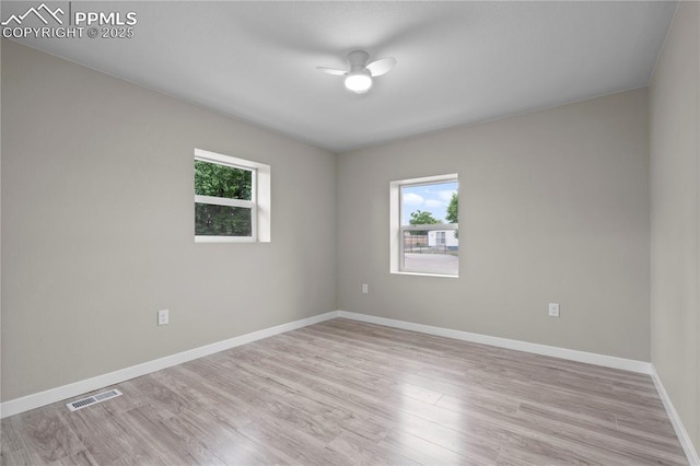 1205 Catalpa St, Pueblo, CO 81001 - empty room featuring plenty of natural light, ceiling fan, light wood-style flooring, and baseboards
