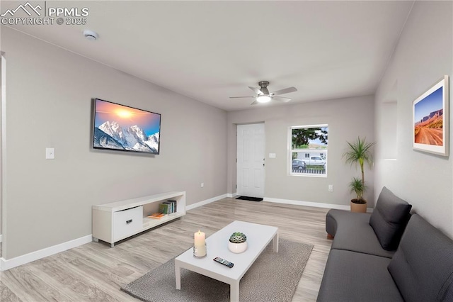1205 Catalpa St, Pueblo, CO 81001 - living area with light wood-style floors, a ceiling fan, and baseboards
