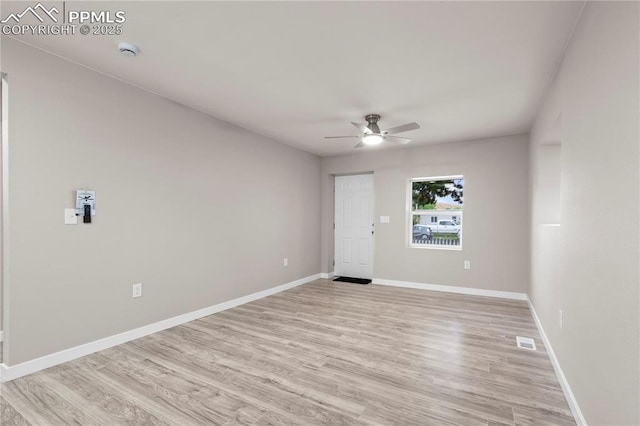 1205 Catalpa St, Pueblo, CO 81001 - empty room featuring ceiling fan, a smoke detector, light wood finished floors, and baseboards