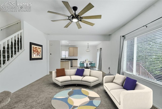 12213 Crystal Downs Rd, Peyton, CO 80831 - living area featuring carpet flooring, plenty of natural light, a ceiling fan, and stairs