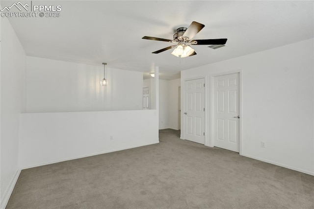 12213 Crystal Downs Rd, Peyton, CO 80831 - spare room with a ceiling fan, carpet floors, and baseboards