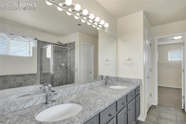 12213 Crystal Downs Rd, Peyton, CO 80831 - bathroom with a shower stall, double vanity, a bath, tile patterned floors, and a spacious closet
