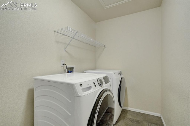 12213 Crystal Downs Rd, Peyton, CO 80831 - laundry area with washing machine and dryer and baseboards