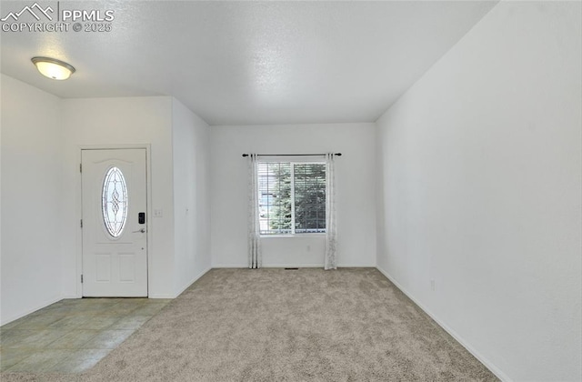 12213 Crystal Downs Rd, Peyton, CO 80831 - foyer with carpet flooring