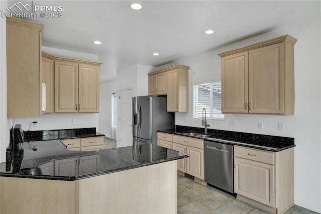 12213 Crystal Downs Rd, Peyton, CO 80831 - kitchen with stainless steel appliances, light brown cabinetry, a sink, a peninsula, and dark stone countertops