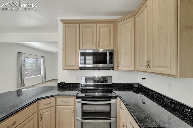 12213 Crystal Downs Rd, Peyton, CO 80831 - kitchen featuring appliances with stainless steel finishes, light brown cabinets, and dark stone countertops