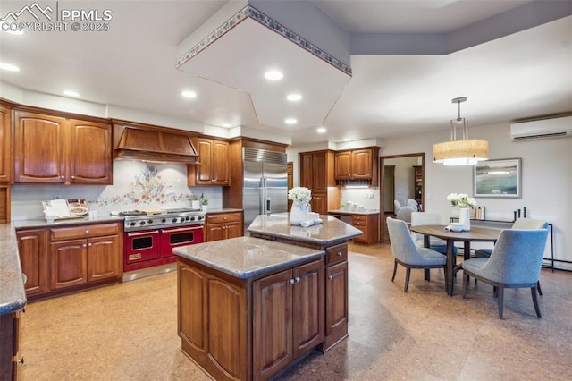 170 Salisbury Ct, Colorado Springs, CO 80906 - kitchen featuring high end appliances, a wall unit AC, custom range hood, a center island, and recessed lighting