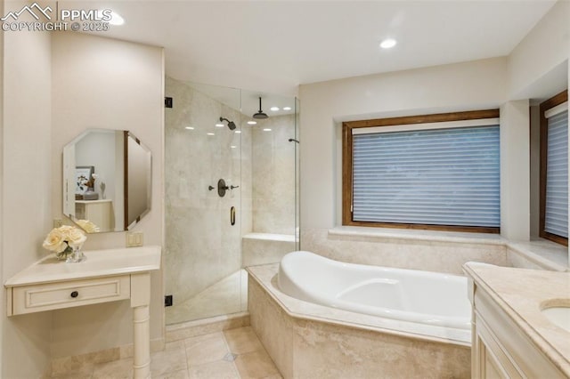 170 Salisbury Ct, Colorado Springs, CO 80906 - bathroom with a shower stall, vanity, a garden tub, and tile patterned floors