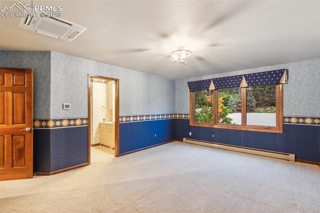170 Salisbury Ct, Colorado Springs, CO 80906 - empty room with a baseboard heating unit, wallpapered walls, carpet floors, and baseboards