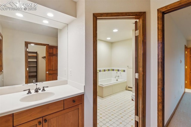 170 Salisbury Ct, Colorado Springs, CO 80906 - bathroom with vanity, a garden tub, baseboard heating, recessed lighting, and baseboards