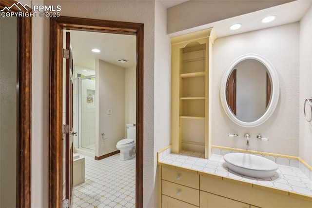 170 Salisbury Ct, Colorado Springs, CO 80906 - bathroom featuring a shower stall, toilet, vanity, and recessed lighting