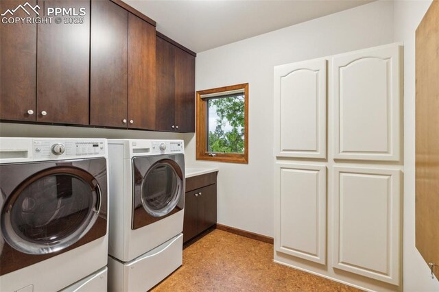 170 Salisbury Ct, Colorado Springs, CO 80906 - laundry room with washer and dryer, cabinet space, baseboards, and light flooring