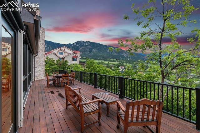 170 Salisbury Ct, Colorado Springs, CO 80906 - wooden deck with outdoor dining space and a mountain view
