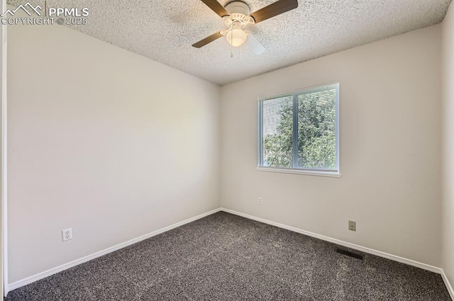 869 Marshall Dr, Fountain, CO 80817 - empty room featuring a textured ceiling, dark carpet, baseboards, and ceiling fan