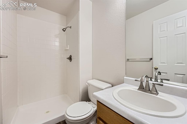 869 Marshall Dr, Fountain, CO 80817 - full bathroom with toilet, vanity, and a tile shower