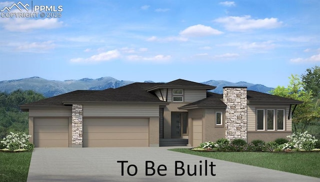 16277 Gammon Ct, Monument, CO 80132 - prairie-style home with a mountain view, a garage, and concrete driveway