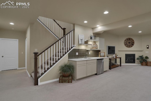 16277 Gammon Ct, Monument, CO 80132 - kitchen with light colored carpet, recessed lighting, baseboards, refrigerator, and decorative backsplash