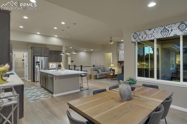 16277 Gammon Ct, Monument, CO 80132 - dining room featuring ceiling fan, light wood-type flooring, recessed lighting, and baseboards