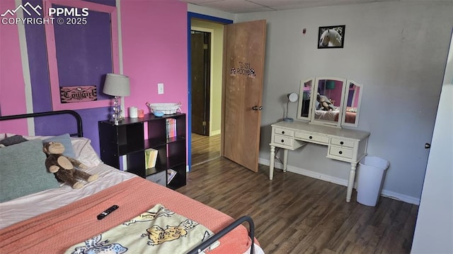 414 7th St, Hugo, CO 80821 - bedroom with wood finished floors and baseboards