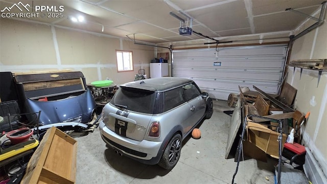 414 7th St, Hugo, CO 80821 - garage with a garage door opener and water heater