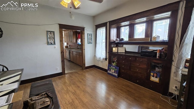 414 7th St, Hugo, CO 80821 - entrance foyer featuring ceiling fan, wood finished floors, and baseboards