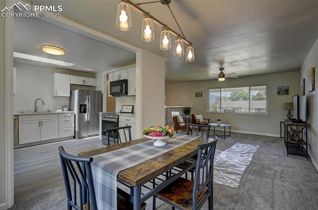 1135 Server Dr, Colorado Springs, CO 80910 - dining area with a ceiling fan and baseboards