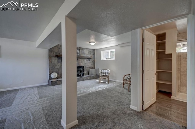 1135 Server Dr, Colorado Springs, CO 80910 - below grade area with carpet, a textured ceiling, and baseboards