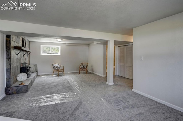 1135 Server Dr, Colorado Springs, CO 80910 - basement featuring carpet floors, baseboards, and a fireplace