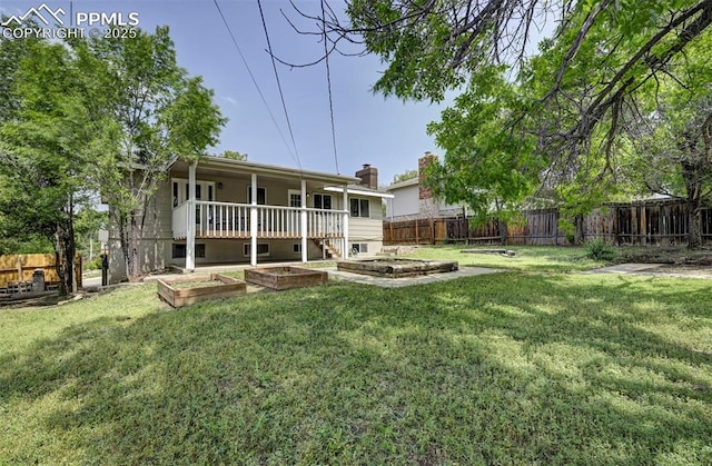 1135 Server Dr, Colorado Springs, CO 80910 - back of property featuring a garden