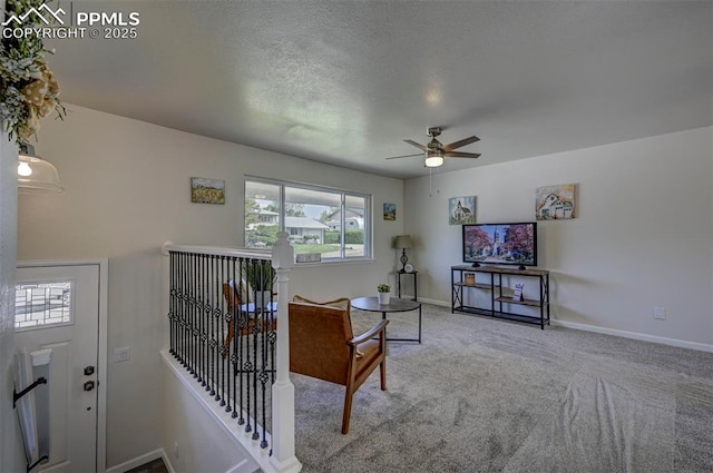 1135 Server Dr, Colorado Springs, CO 80910 - carpeted living room featuring ceiling fan, plenty of natural light, and baseboards