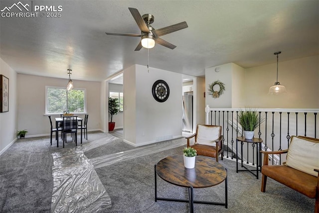 1135 Server Dr, Colorado Springs, CO 80910 - carpeted living room with ceiling fan and baseboards