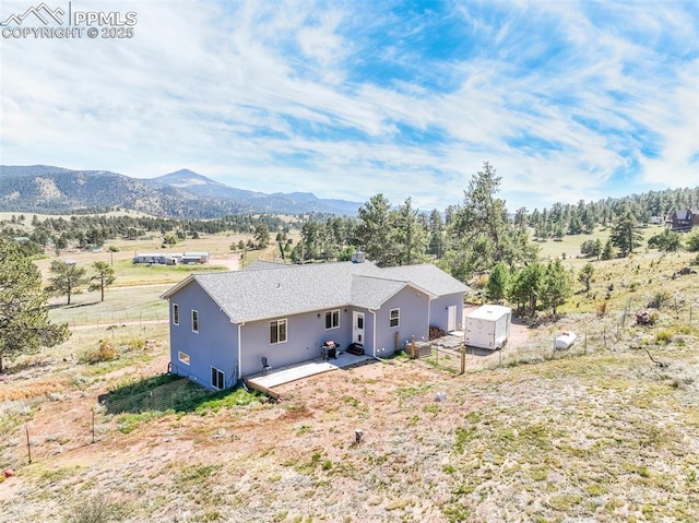 325 Spring Valley Dr, Florissant, CO 80816 - aerial view of property and surrounding area featuring a mountainous background