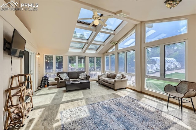 3660 E Wade Ln, Colorado Springs, CO 80917 - sunroom / solarium featuring a skylight, healthy amount of natural light, wood finished floors, high vaulted ceiling, and beam ceiling