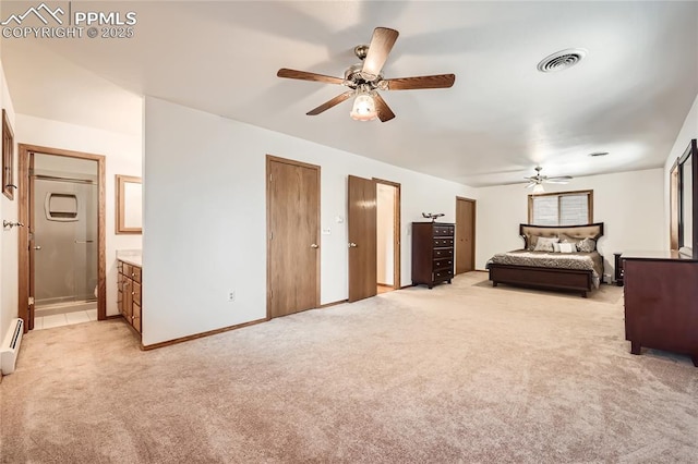 3660 E Wade Ln, Colorado Springs, CO 80917 - bedroom featuring light carpet, ensuite bathroom, a baseboard heating unit, baseboards, and a ceiling fan