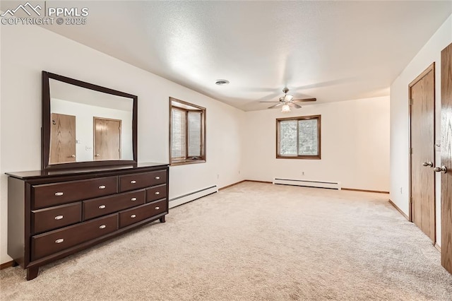 3660 E Wade Ln, Colorado Springs, CO 80917 - unfurnished bedroom featuring a baseboard radiator, light carpet, baseboards, and ceiling fan