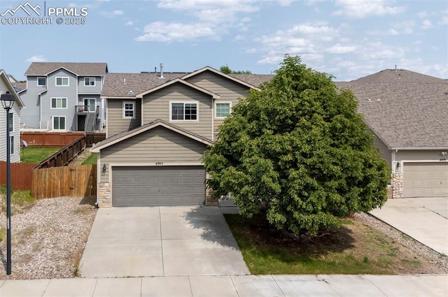 4959 Gami Way, Colorado Springs, CO 80911 - view of front facade with driveway and an attached garage
