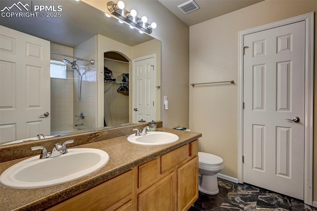 4959 Gami Way, Colorado Springs, CO 80911 - bathroom with toilet, double vanity, marble look tile flooring, and shower / bathtub combination