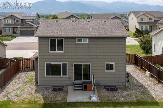 4959 Gami Way, Colorado Springs, CO 80911 - rear view of property with entry steps, a mountain view, a patio, and a fenced backyard