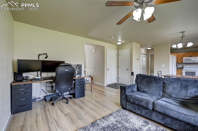 4959 Gami Way, Colorado Springs, CO 80911 - office featuring light wood finished floors, baseboards, a ceiling fan, and a chandelier