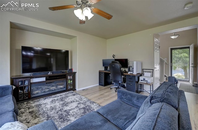 4959 Gami Way, Colorado Springs, CO 80911 - living room featuring wood finished floors, a desk, a ceiling fan, and baseboards