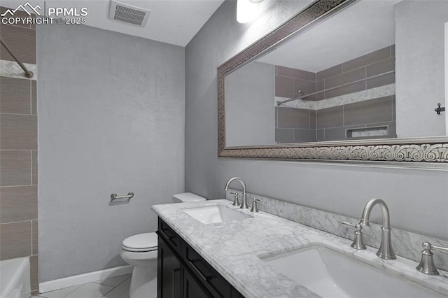 4623 Ranch Cir, Colorado Springs, CO 80918 - full bath with double vanity, toilet, tiled shower / bath combo, and baseboards