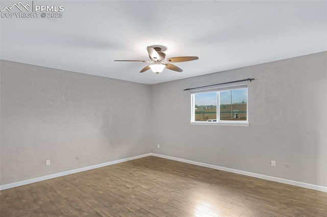 4623 Ranch Cir, Colorado Springs, CO 80918 - unfurnished room with ceiling fan, wood finished floors, and baseboards