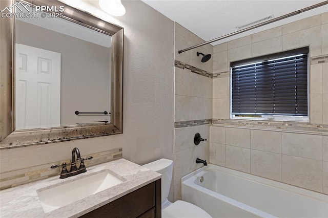 4623 Ranch Cir, Colorado Springs, CO 80918 - full bath with vanity, toilet, shower / tub combination, and a textured wall