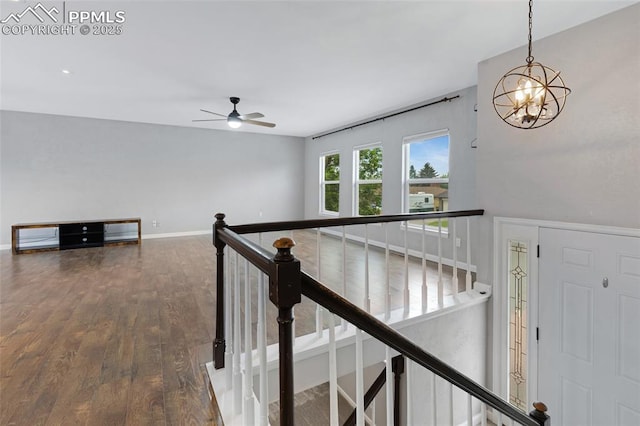 4623 Ranch Cir, Colorado Springs, CO 80918 - hall featuring an upstairs landing, a chandelier, wood finished floors, and baseboards