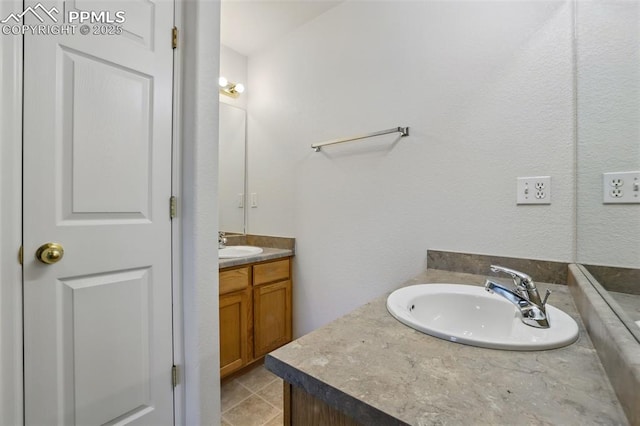 688 Bosque Vista Pt, Colorado Springs, CO 80916 - bathroom with vanity and tile patterned flooring