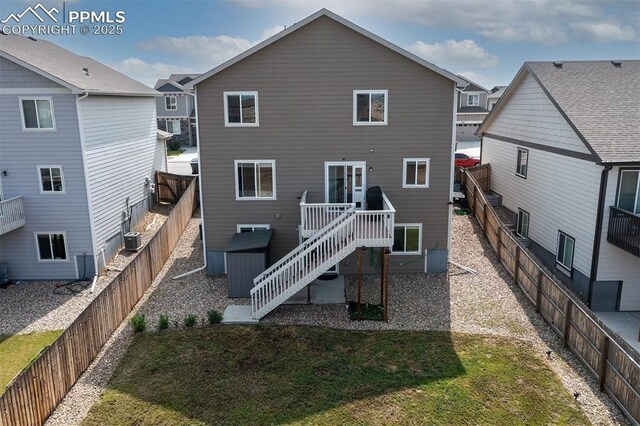 6078 Jorie Rd, Colorado Springs, CO 80927 - back of house featuring stairs, a wooden deck, and central air condition unit