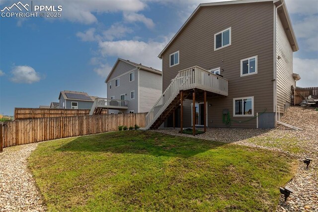 6078 Jorie Rd, Colorado Springs, CO 80927 - back of house with stairs and a wooden deck